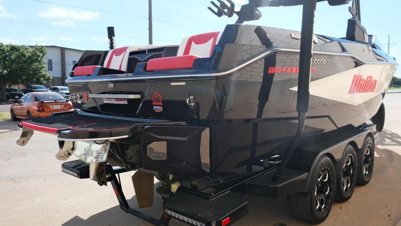 2025 MALIBU WAKESETTER 25 LSV  in a RED-BLACK-WHITE exterior color. Family PowerSports (877) 886-1997 familypowersports.com 