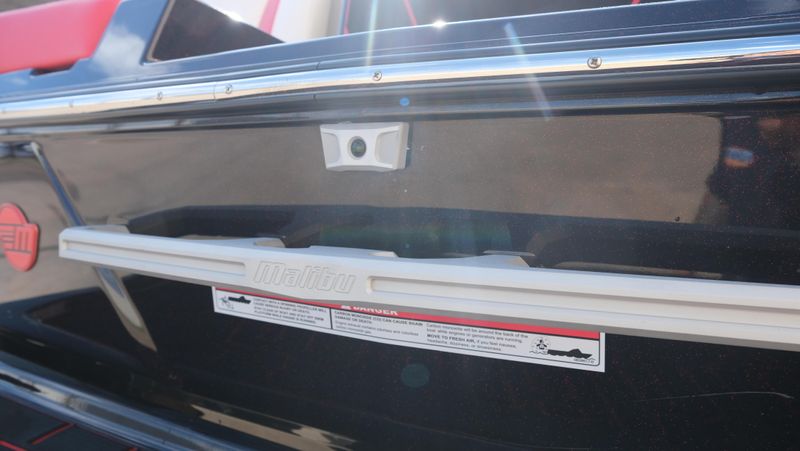 2025 MALIBU WAKESETTER 25 LSV  in a RED-BLACK-WHITE exterior color. Family PowerSports (877) 886-1997 familypowersports.com 