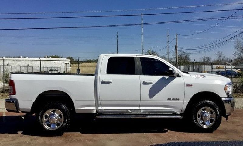 2022 RAM 2500 Big Horn in a Bright White Clear Coat exterior color and Blackinterior. Matthews Chrysler Dodge Jeep Ram 918-276-8729 cyclespecialties.com 