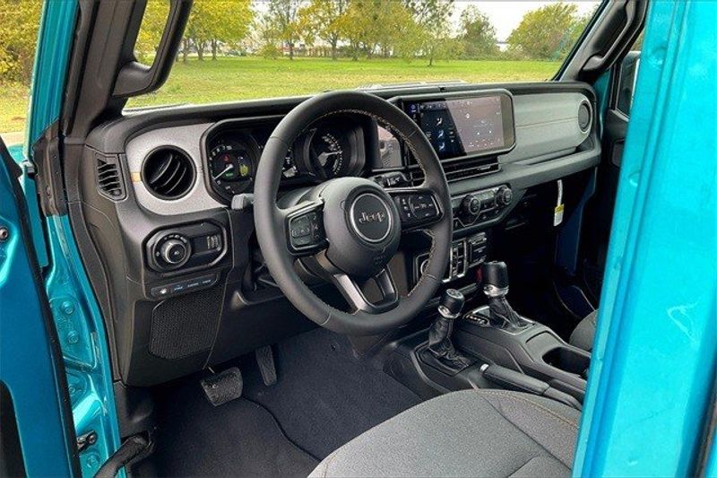 2024 Jeep Wrangler 4-door Sport S 4xe in a Bikini Pearl Coat exterior color and Blackinterior. Elder CDJR Cedar Creek 430-558-0679 eldercedarcreek.com 