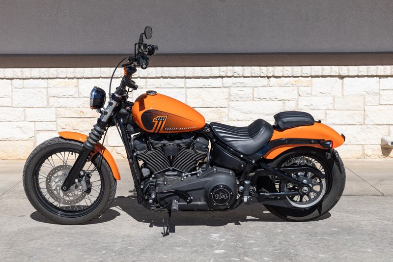 2021 HARLEY Softail Street Bob 114 in a ORANGE exterior color. Family PowerSports (877) 886-1997 familypowersports.com 