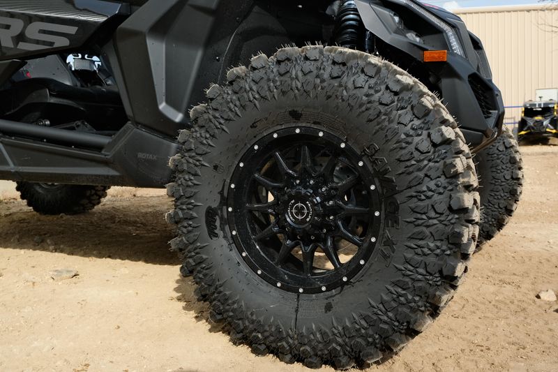 NEW 2026 CAN-AM MAVERICK X3 X RS TURBO RR WITH 1025 INCH TOUCHSCREEN  in a TRIPLE BLACK exterior color. Family PowerSports (877) 886-1997 familypowersports.com 