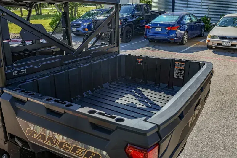 2025 POLARIS RANGER CREW 1000 PREMIUM PURSUIT CAMO in a POLARIS PURSUIT CAMO exterior color. Family PowerSports (877) 886-1997 familypowersports.com 