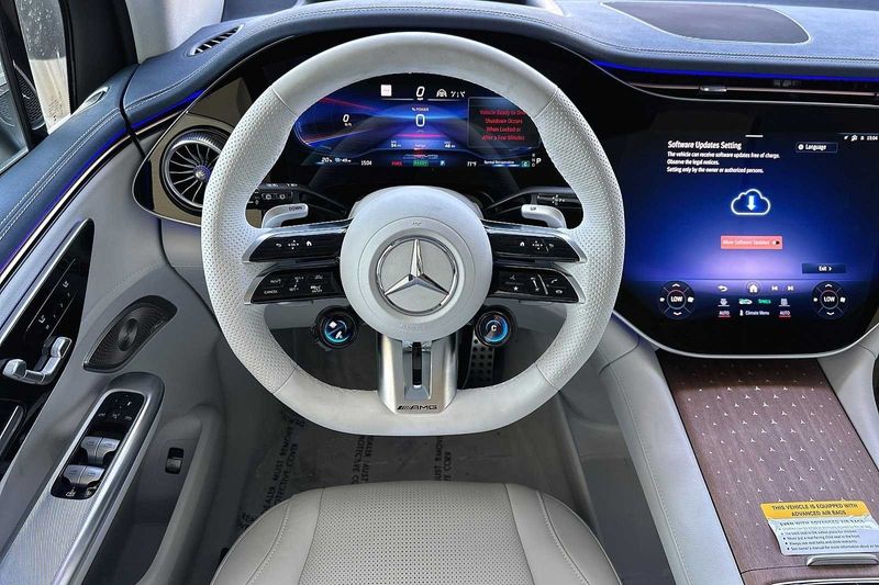 2024 Mercedes-Benz AMG EQE Base in a POLAR WHITE exterior color and GREY/BLUEinterior. SHELLY AUTOMOTIVE shellyautomotive.com 