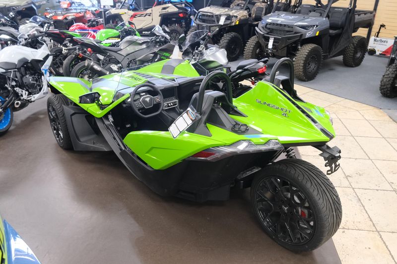 NEW 2025 POLARIS SLINGSHOT SL MANUAL  in a LIQUID LIME exterior color. Family PowerSports (877) 886-1997 familypowersports.com 