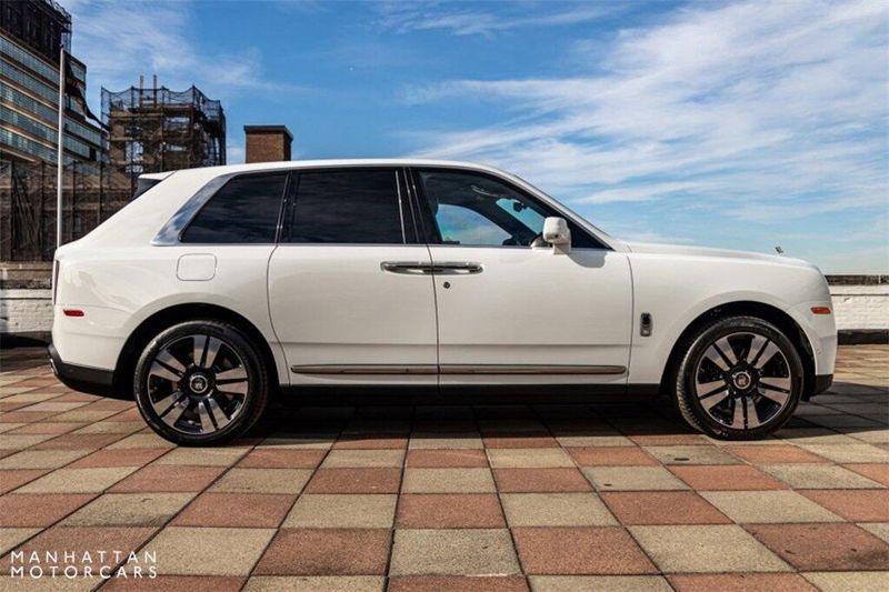 2024 Rolls-Royce Cullinan Silver Badge in a Arctic White exterior color and Black with Charles Blue Accentsinterior. Lotus Manhattan 347-395-5714 lotusmanhattan.com 