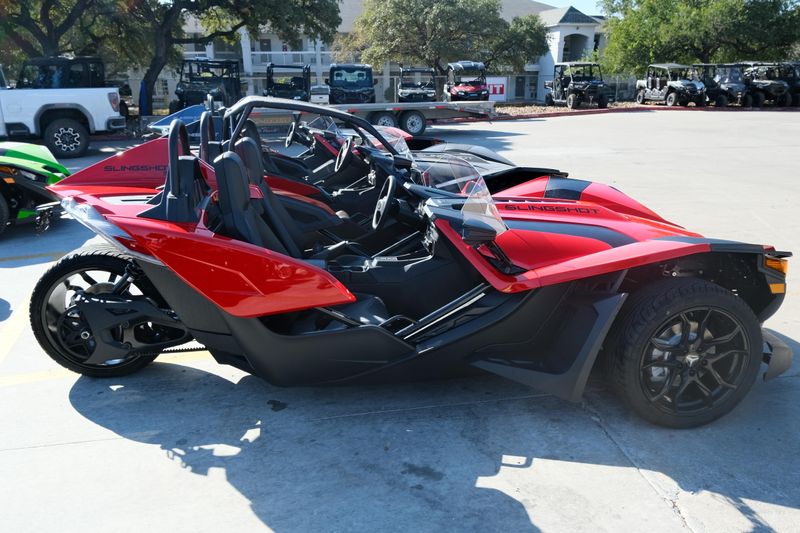 NEW 2025 POLARIS SLINGSHOT S AUTODRIVE  in a SLINGSHOT RED exterior color. Family PowerSports (877) 886-1997 familypowersports.com 