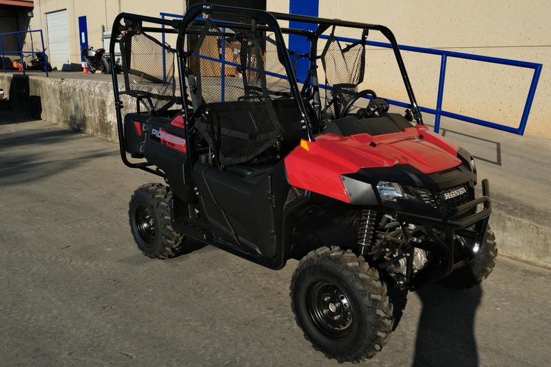 NEW 2026 HONDA PIONEER 7004  in a HERO RED exterior color. Family PowerSports (877) 886-1997 familypowersports.com