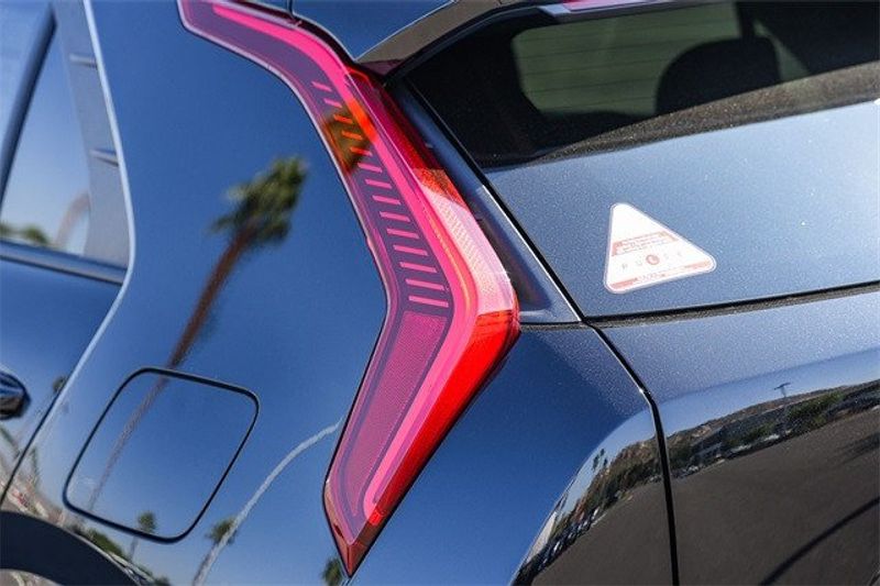 2024 Kia Niro EX Touring in a Aurora Black exterior color and Grayinterior. BEACH BLVD OF CARS beachblvdofcars.com 