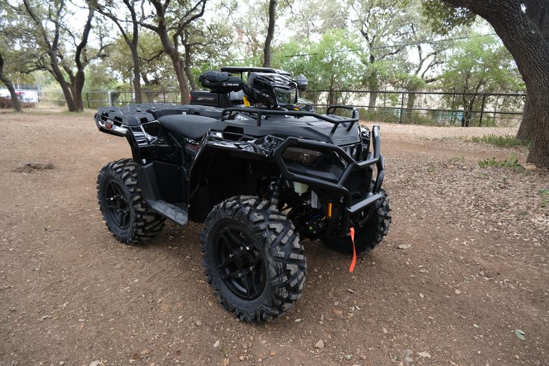 2025 POLARIS SPORTSMAN 570 TRAIL ONYX BLACK in a ONYX BLACK exterior color. Family PowerSports (877) 886-1997 familypowersports.com 