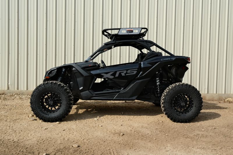 NEW 2026 CAN-AM MAVERICK X3 X RS TURBO RR WITH 1025 INCH TOUCHSCREEN  in a TRIPLE BLACK exterior color. Family PowerSports (877) 886-1997 familypowersports.com 