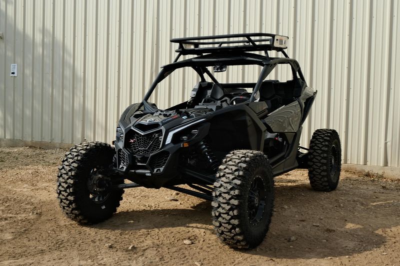 NEW 2026 CAN-AM MAVERICK X3 X RS TURBO RR WITH 1025 INCH TOUCHSCREEN  in a TRIPLE BLACK exterior color. Family PowerSports (877) 886-1997 familypowersports.com 