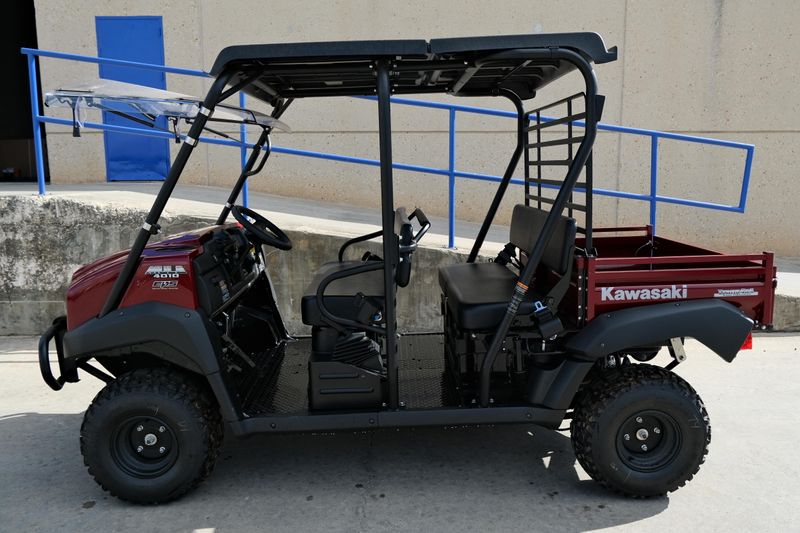 NEW 2026 KAWASAKI MULE 4010 TRANS4X4  in a DARK ROYAL RED exterior color. Family PowerSports (877) 886-1997 familypowersports.com 