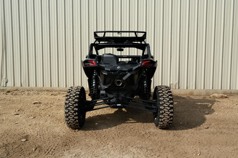 NEW 2026 CAN-AM MAVERICK X3 X RS TURBO RR WITH 1025 INCH TOUCHSCREEN  in a TRIPLE BLACK exterior color. Family PowerSports (877) 886-1997 familypowersports.com 