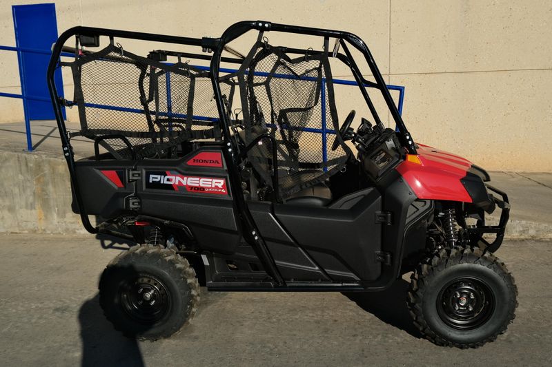 NEW 2026 HONDA PIONEER 7004  in a HERO RED exterior color. Family PowerSports (877) 886-1997 familypowersports.com