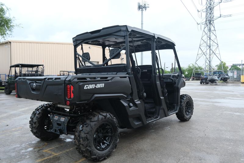 NEW 2026 CAN-AM DEFENDER MAX DPS HD9  in a STEALTH BLACK exterior color. Family PowerSports (877) 886-1997 familypowersports.com 