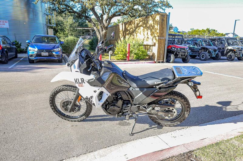 2025 KAWASAKI KLR 650 S  PEARL CRYSTAL WHITEMETALLIC CARBON GRAY in a PEARL CRYSTAL WHITE/METALLIC CARBON GRAY exterior color. Family PowerSports (877) 886-1997 familypowersports.com 