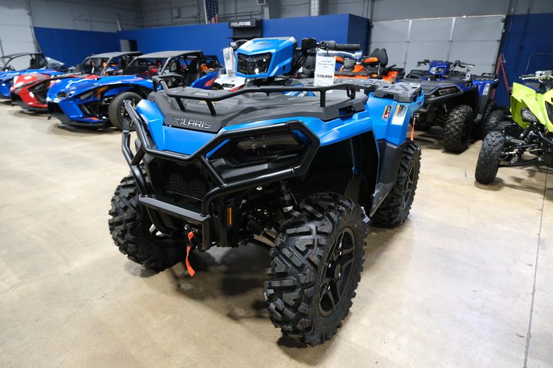 2025 POLARIS SPORTSMAN 570 TRAIL ELECTRIC BLUE in a ELECTRIC BLUE exterior color. Family PowerSports (877) 886-1997 familypowersports.com 