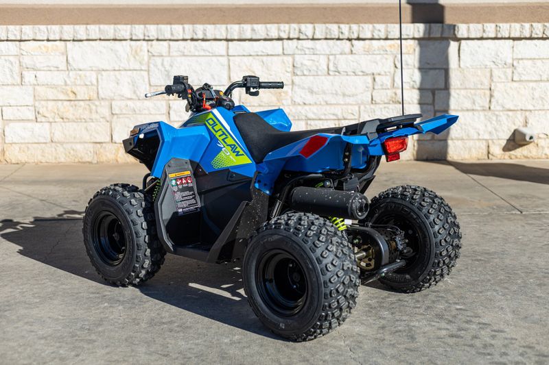 2024 POLARIS ATV24OUTLAW 70BLUELIME in a BLUE-GREEN exterior color. Family PowerSports (877) 886-1997 familypowersports.com 