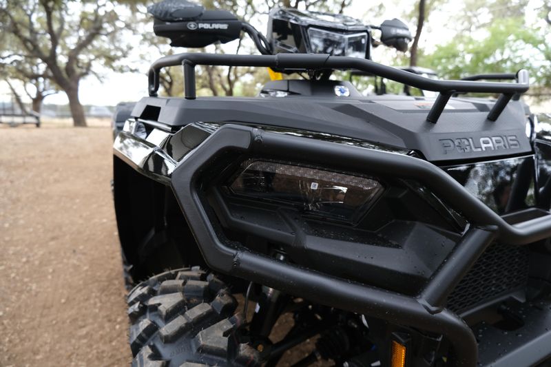 2025 POLARIS SPORTSMAN 570 TRAIL ONYX BLACK in a ONYX BLACK exterior color. Family PowerSports (877) 886-1997 familypowersports.com 