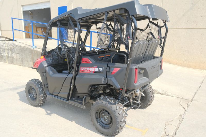 NEW 2026 HONDA PIONEER 7004  in a HERO RED exterior color. Family PowerSports (877) 886-1997 familypowersports.com