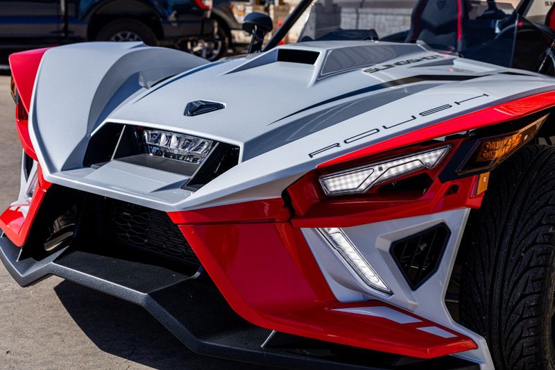 2024 POLARIS SLINGSHOT ROUSH MANUAL RACETRACK RED in a RED exterior color. Family PowerSports (877) 886-1997 familypowersports.com 