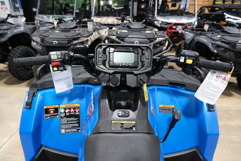 2025 POLARIS SPORTSMAN 570 TRAIL ELECTRIC BLUE in a ELECTRIC BLUE exterior color. Family PowerSports (877) 886-1997 familypowersports.com 