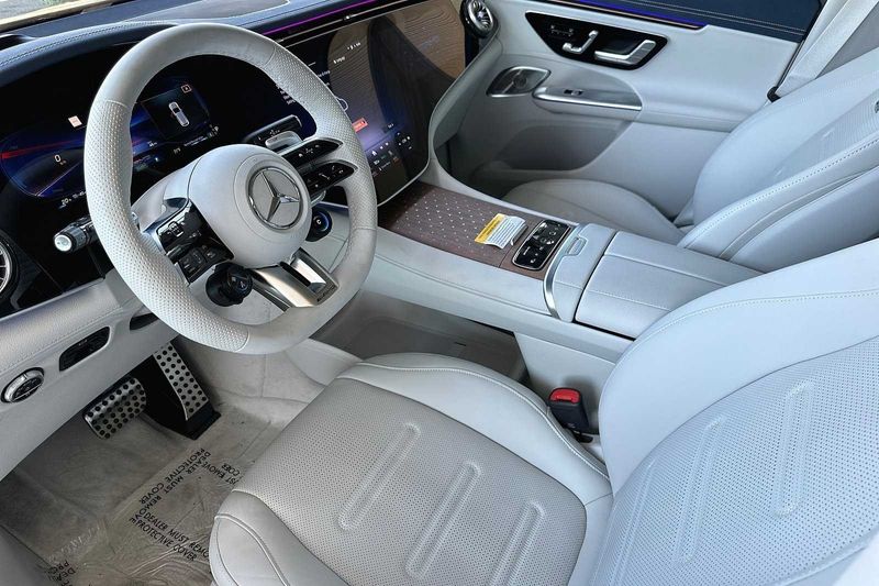 2024 Mercedes-Benz AMG EQE Base in a POLAR WHITE exterior color and GREY/BLUEinterior. SHELLY AUTOMOTIVE shellyautomotive.com 