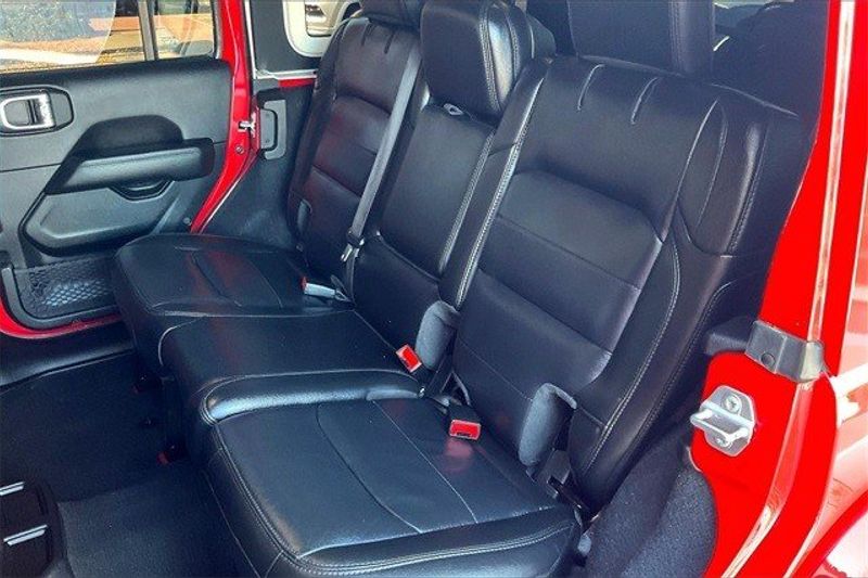 2021 Jeep Wrangler Unlimited Sahara Altitude in a Firecracker Red Clear Coat exterior color and Blackinterior. Crystal Chrysler Jeep Dodge Ram (760) 507-2975 pixelmotiondemo.com 