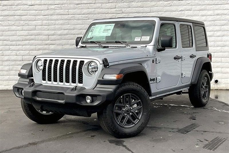 2024 Jeep Wrangler 4-door Sport S in a Silver Zynith Clear Coat exterior color and Blackinterior. Crystal Chrysler Jeep Dodge Ram (760) 507-2975 pixelmotiondemo.com 