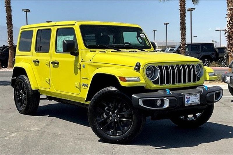 2024 Jeep Wrangler 4-door Sahara 4xe in a High Velocity Clear Coat exterior color and Blackinterior. I-10 Chrysler Dodge Jeep Ram (760) 565-5160 pixelmotiondemo.com 