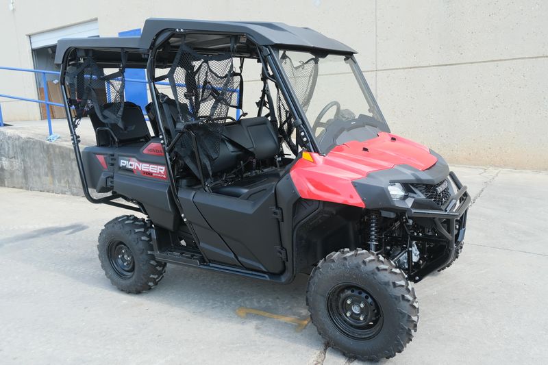 NEW 2026 HONDA PIONEER 7004  in a HERO RED exterior color. Family PowerSports (877) 886-1997 familypowersports.com