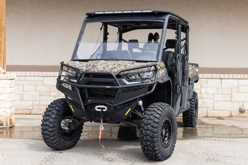 2023 CAN-AM SSV DEF MAX XMR 65 HD10 BC 23 in a CAMO exterior color. Family PowerSports (877) 886-1997 familypowersports.com 