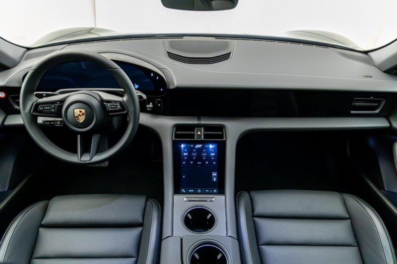 2023 Porsche Taycan  in a Jet Black Metallic exterior color and Blackinterior. Lotus Manhattan 347-395-5714 lotusmanhattan.com 