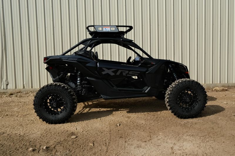 NEW 2026 CAN-AM MAVERICK X3 X RS TURBO RR WITH 1025 INCH TOUCHSCREEN  in a TRIPLE BLACK exterior color. Family PowerSports (877) 886-1997 familypowersports.com 