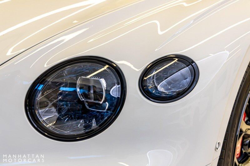 2024 Bentley Continental GT Speed Convertible in a Glacier White exterior color and Hotspur & Belugainterior. Lotus Manhattan 347-395-5714 lotusmanhattan.com 