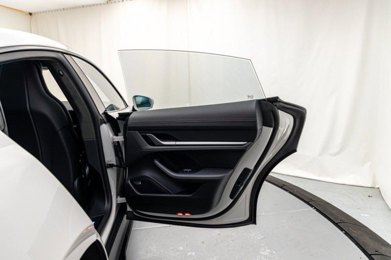 2024 Porsche Taycan GTS in a Chalk exterior color and Blackinterior. Lotus Manhattan 347-395-5714 lotusmanhattan.com 