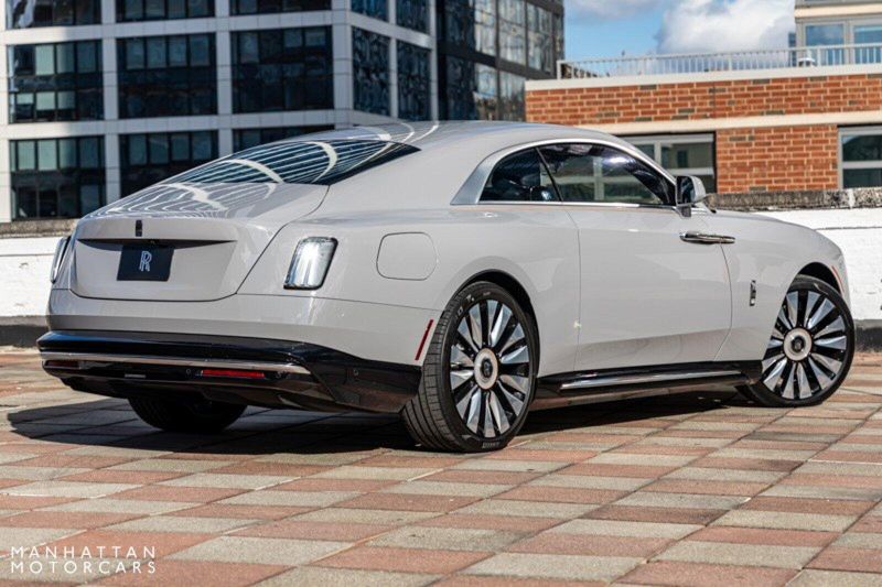 2024 Rolls-Royce Spectre  in a Tempest Grey exterior color and Black with Mandarin Accentsinterior. Lotus Manhattan 347-395-5714 lotusmanhattan.com 