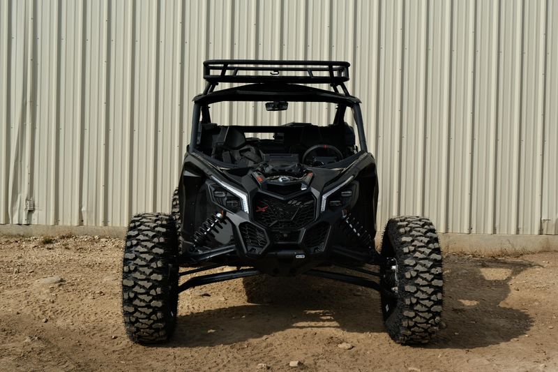 NEW 2026 CAN-AM MAVERICK X3 X RS TURBO RR WITH 1025 INCH TOUCHSCREEN  in a TRIPLE BLACK exterior color. Family PowerSports (877) 886-1997 familypowersports.com 