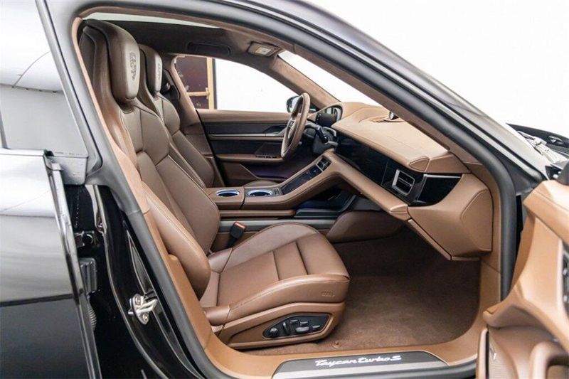 2023 Porsche Taycan Turbo S in a Jet Black Metallic exterior color and Truffle Browninterior. Lotus Manhattan 347-395-5714 lotusmanhattan.com 