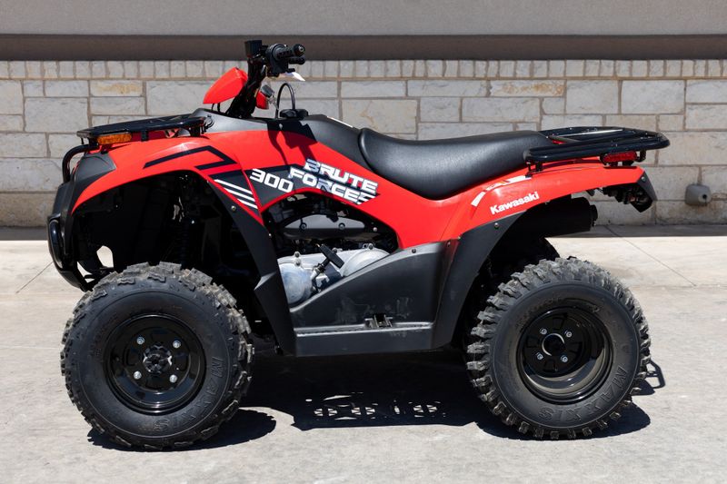 2024 KAWASAKI Brute Force 300 in a RED exterior color. Family PowerSports (877) 886-1997 familypowersports.com 