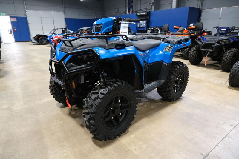 2025 POLARIS SPORTSMAN 570 TRAIL ELECTRIC BLUE in a ELECTRIC BLUE exterior color. Family PowerSports (877) 886-1997 familypowersports.com 