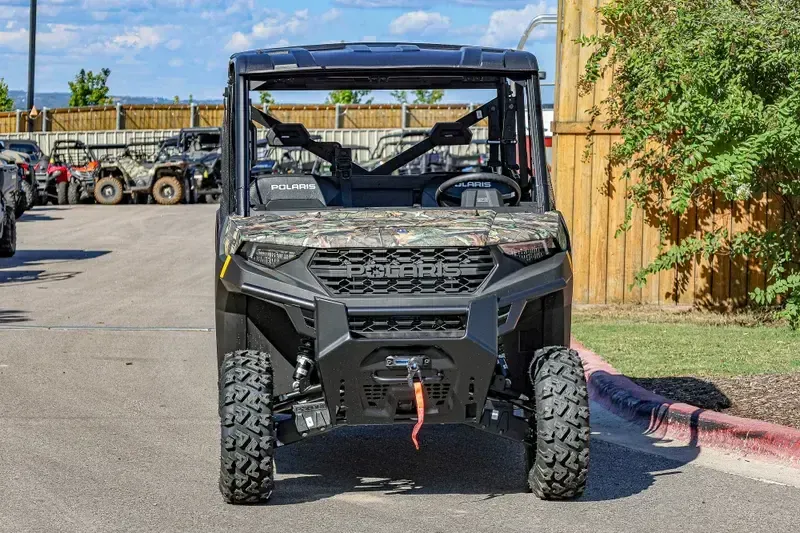 2025 POLARIS RANGER CREW 1000 PREMIUM PURSUIT CAMO in a POLARIS PURSUIT CAMO exterior color. Family PowerSports (877) 886-1997 familypowersports.com 