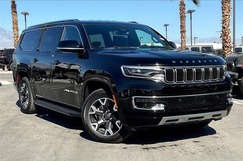 2023 Wagoneer L Series III 4X4 in a Diamond Black Crystal Pearl Coat exterior color and Global Blk Lth Trm Bkt Stinterior. I-10 Chrysler Dodge Jeep Ram (760) 565-5160 pixelmotiondemo.com 