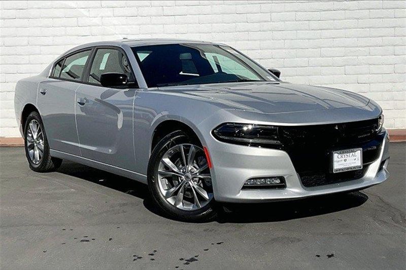 2023 Dodge Charger SXT Awd in a Triple Nickel exterior color and Blackinterior. Crystal Chrysler Jeep Dodge Ram (760) 507-2975 pixelmotiondemo.com 