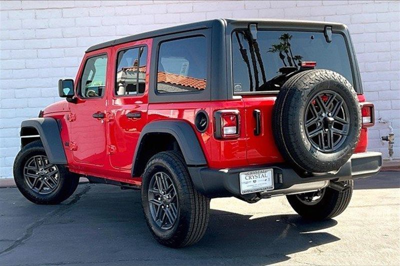 2024 Jeep Wrangler 4-door Sport S in a Firecracker Red Clear Coat exterior color and Blackinterior. Crystal Chrysler Jeep Dodge Ram (760) 507-2975 pixelmotiondemo.com 