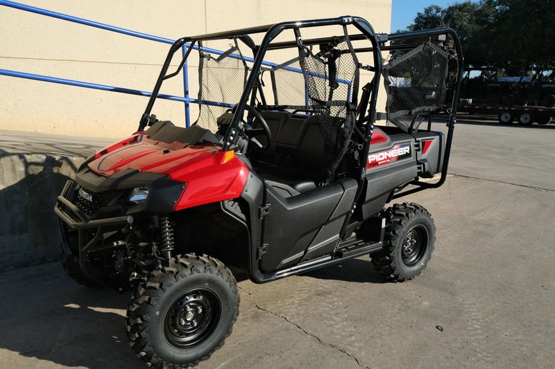 NEW 2026 HONDA PIONEER 7004  in a HERO RED exterior color. Family PowerSports (877) 886-1997 familypowersports.com