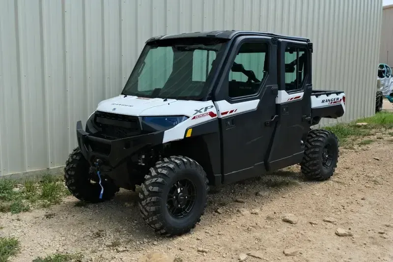 New 2025 Polaris RANGER CREW XP 1000 NORTHSTAR TRAIL BOSS EDITION CRYSTAL WHITE WITH PERFORMANCE RED ACCENTS Image 3