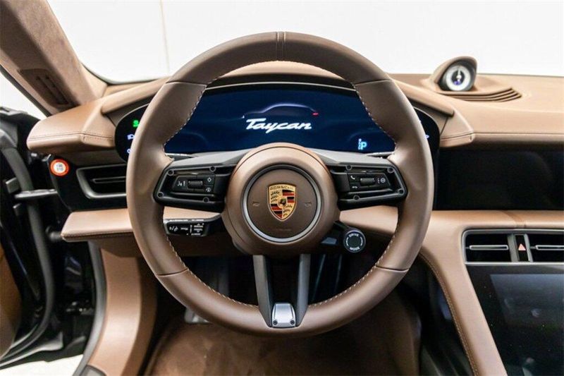 2023 Porsche Taycan Turbo S in a Jet Black Metallic exterior color and Truffle Browninterior. Lotus Manhattan 347-395-5714 lotusmanhattan.com 