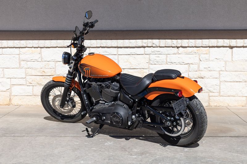 2021 HARLEY Softail Street Bob 114 in a ORANGE exterior color. Family PowerSports (877) 886-1997 familypowersports.com 